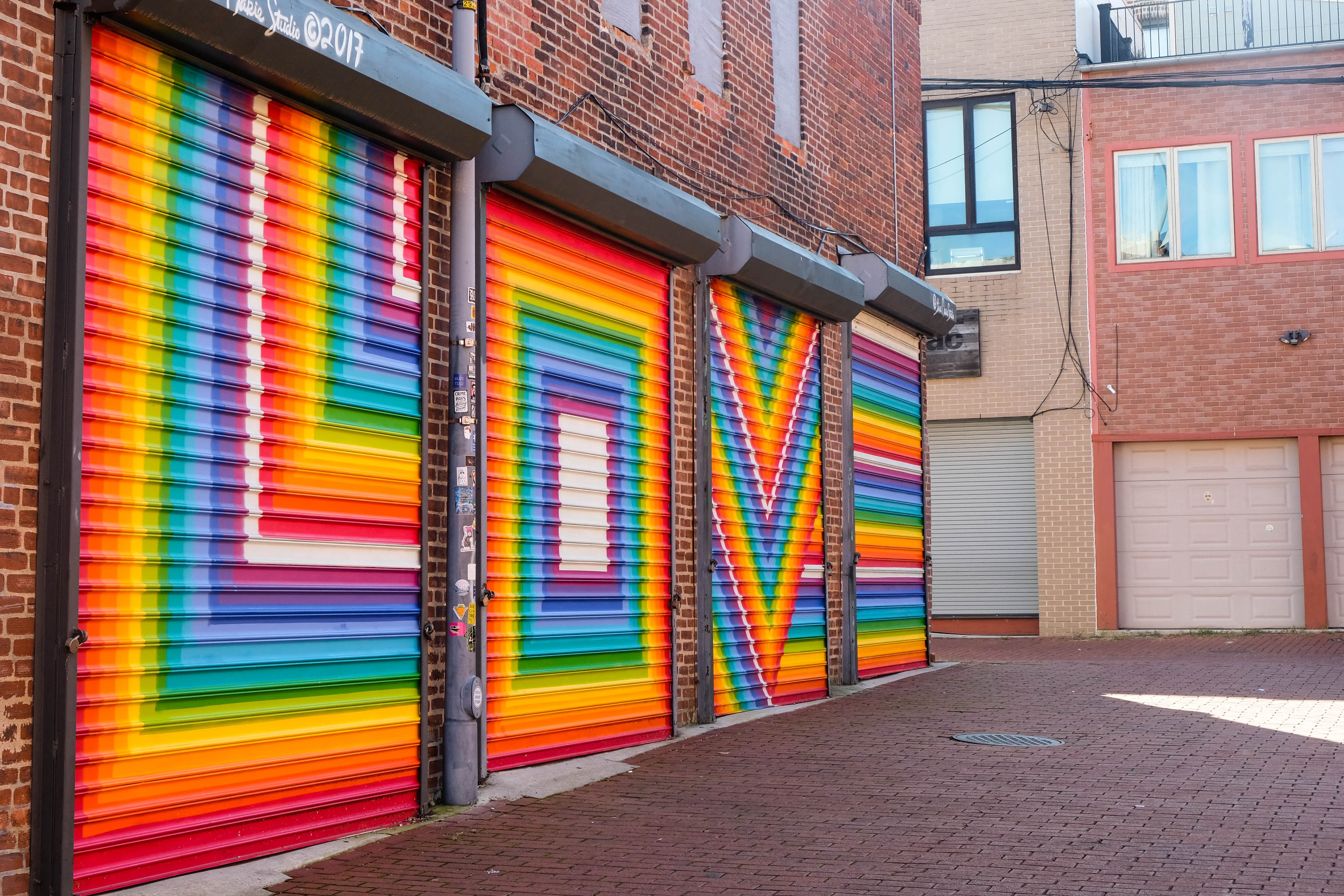 Lively community surrounded in vibrant community featuring Blagden Alley Mural